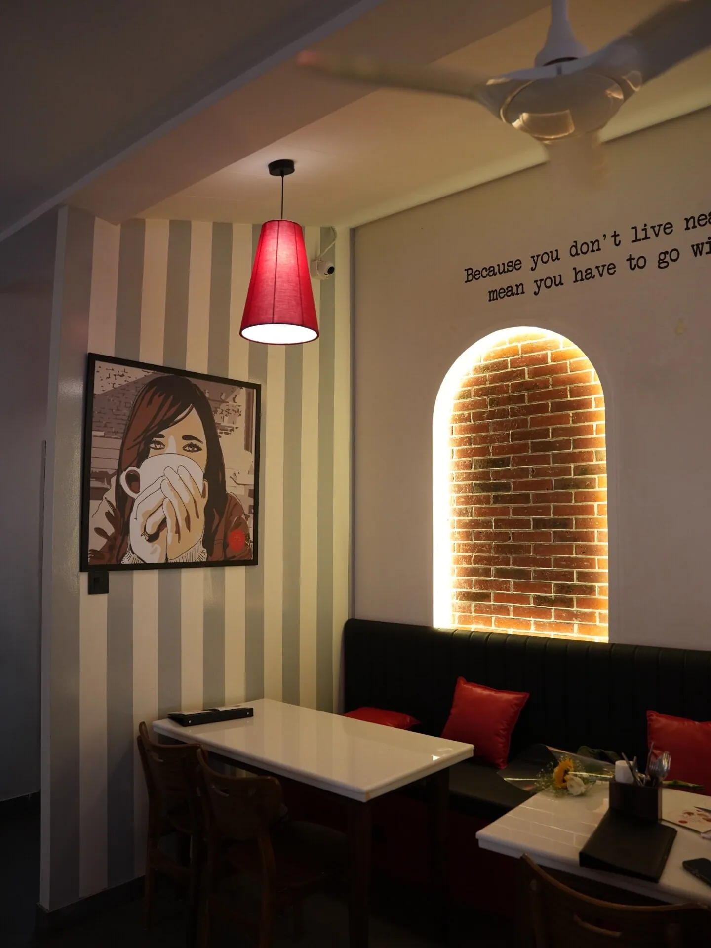 Illuminated niche and material detail inside Café Peter Erandwane Pune — interior by prāngaṇa.