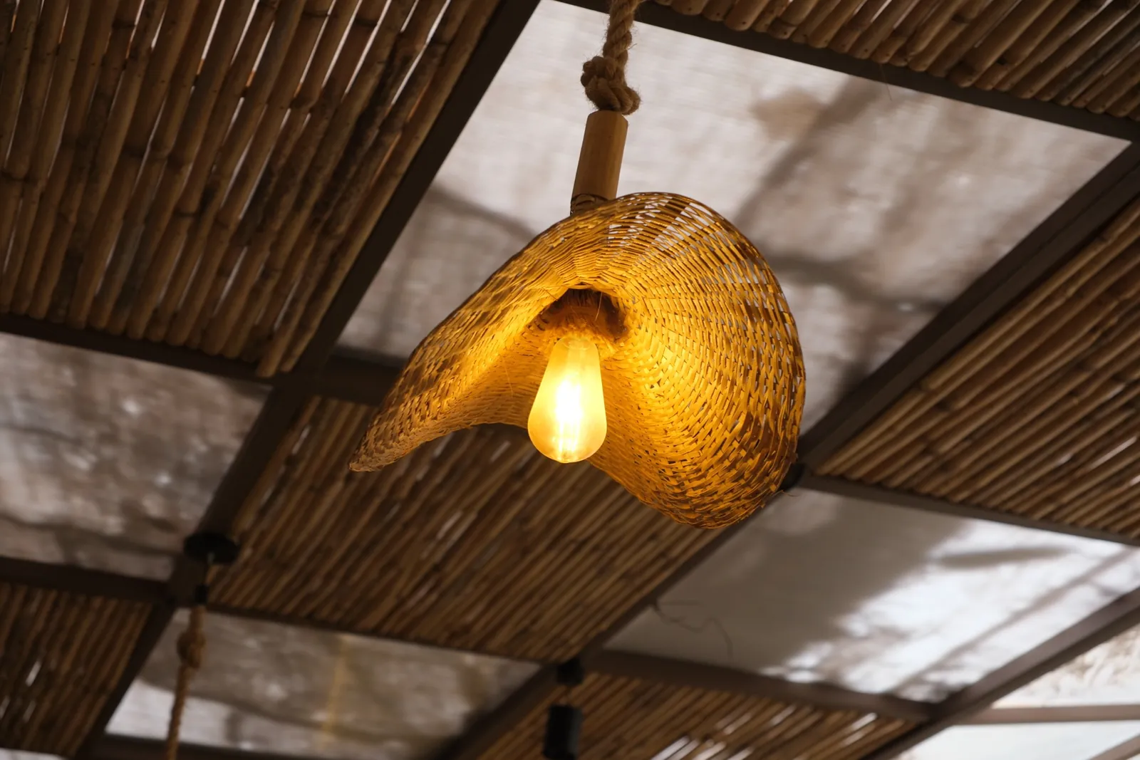 Woven pendant light and canopy detail at Street Coffee BVP Pune — interior by prāngaṇa.