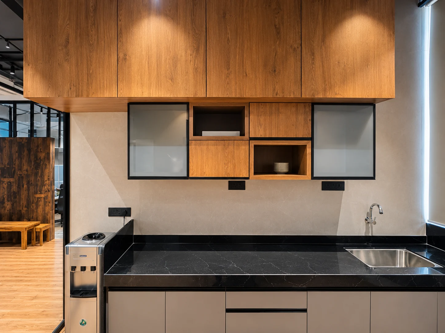 Pantry cabinetry above a dark counter and sink.